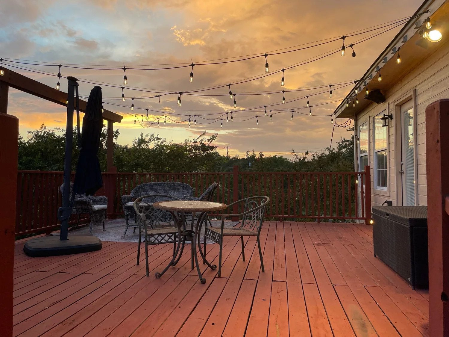 Deck with string lights installed at sunset