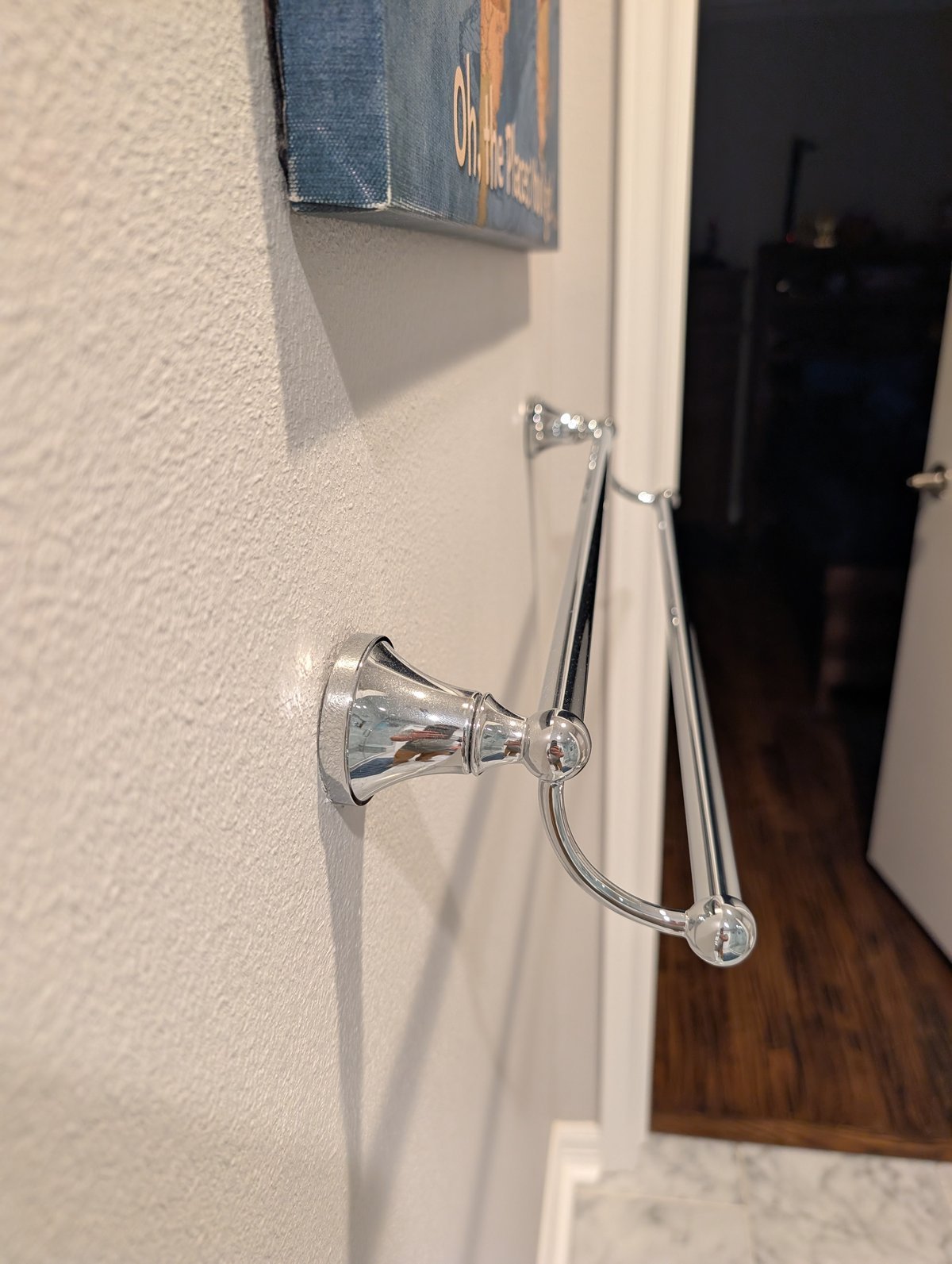 Bathroom light fixture installation over vanity in DFW home