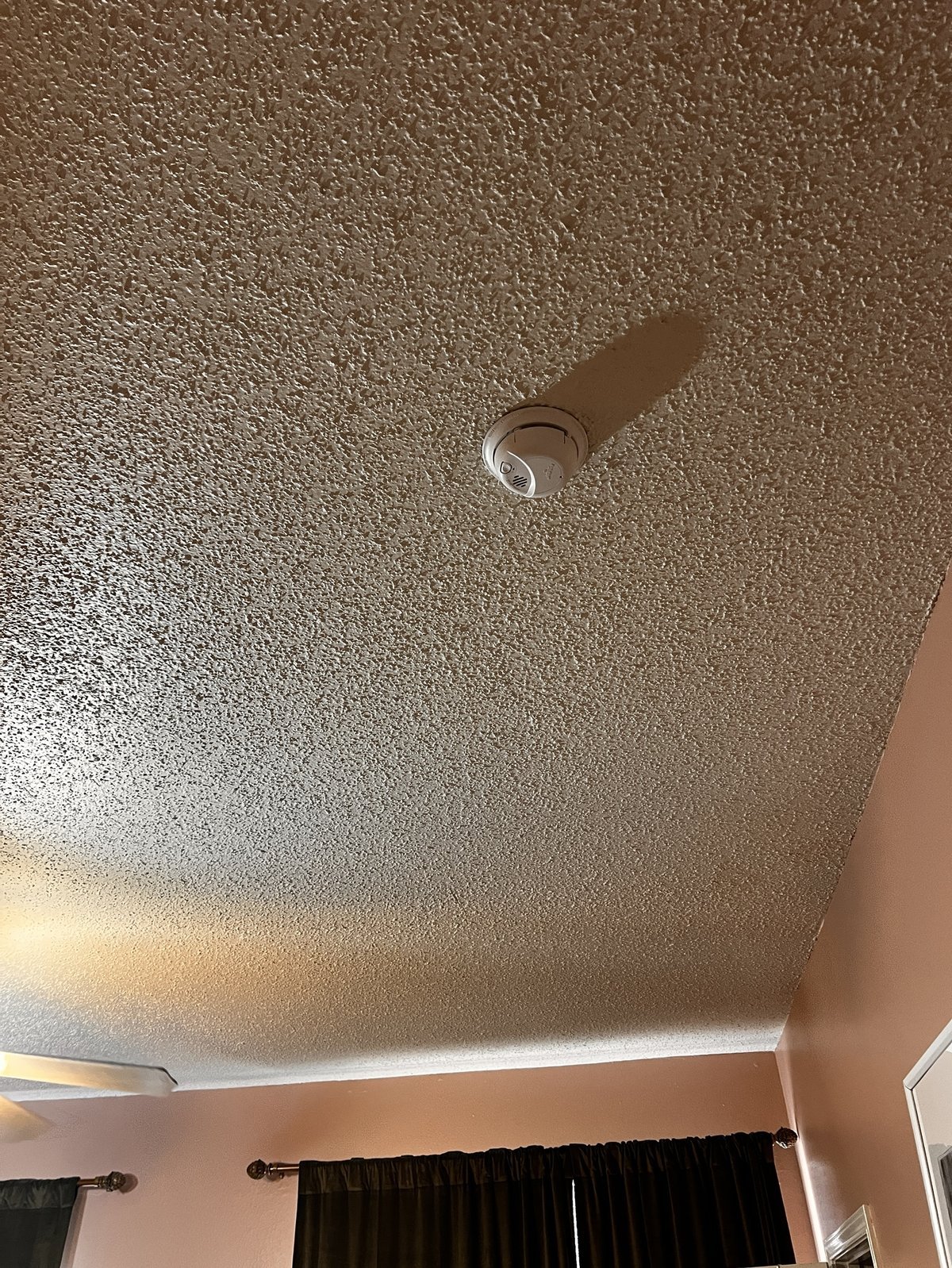 Smoke alarm installed on ceiling in Dallas home